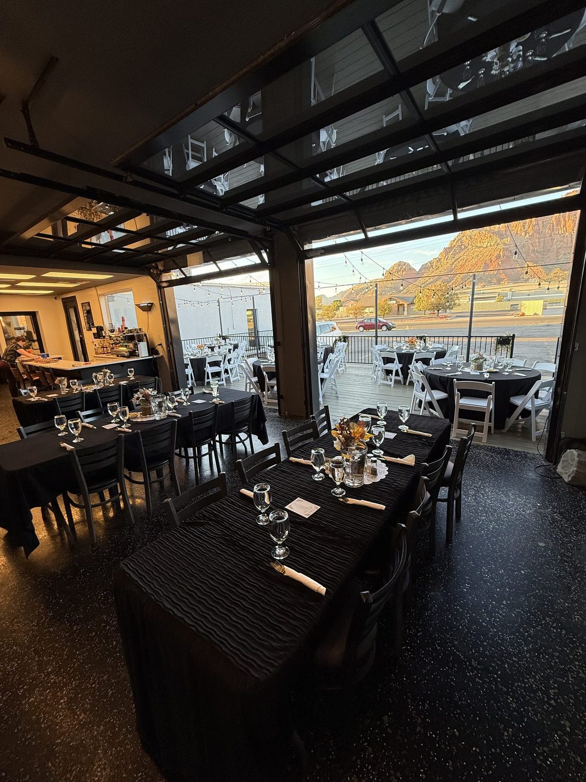 Covered dining area set for guests