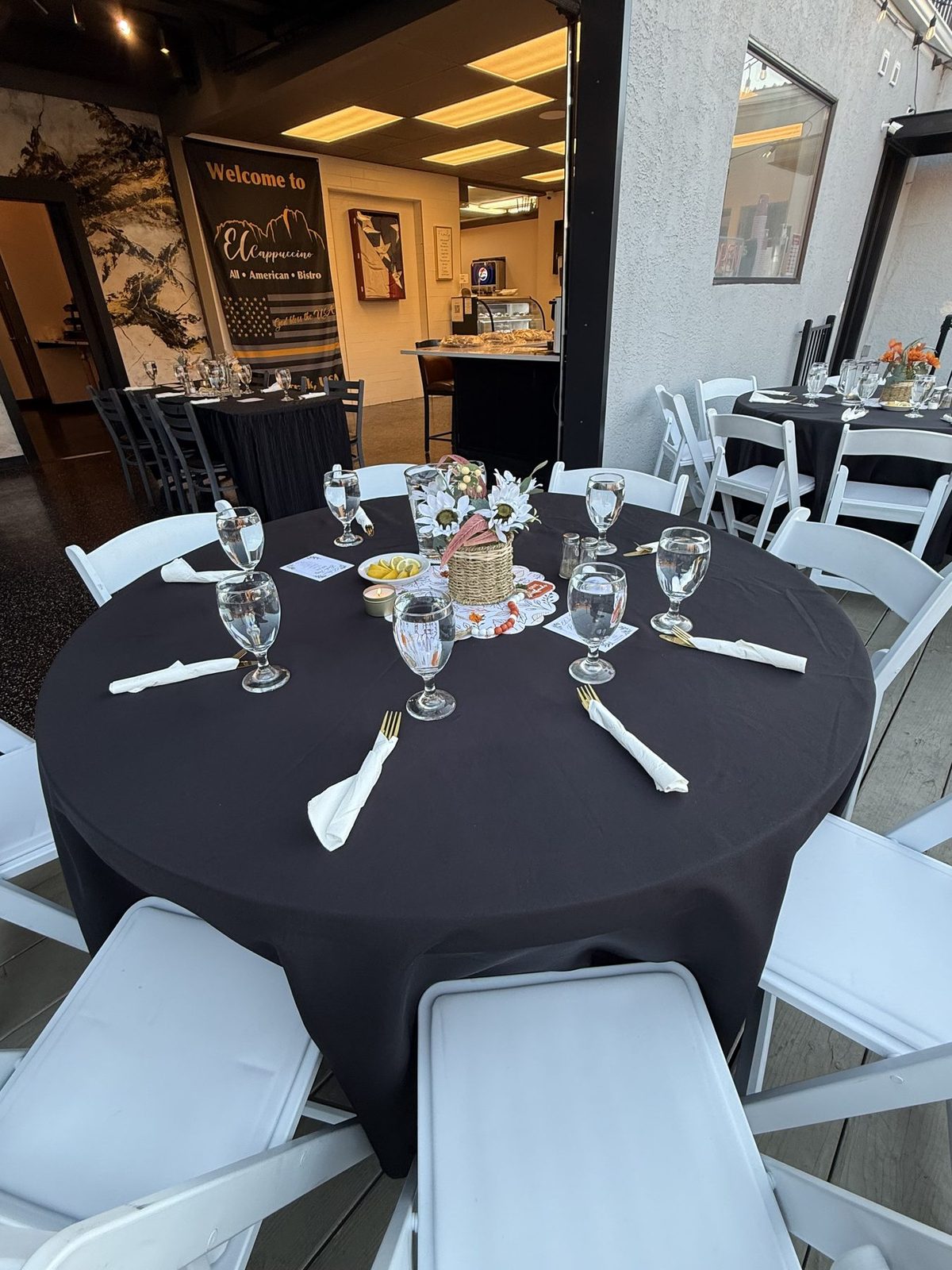 Inside El Cappuccino, with tables set and the counter in the back