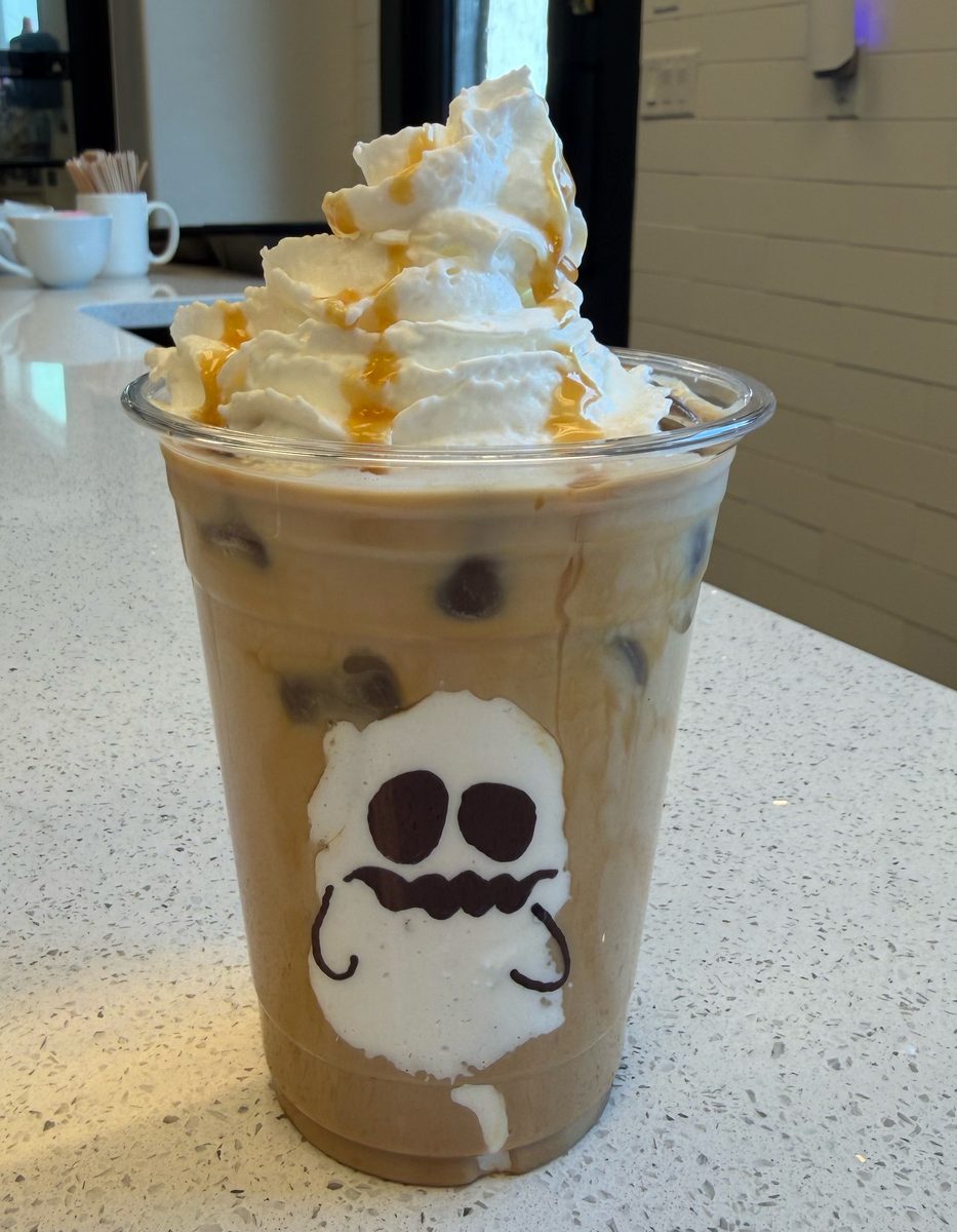 Seasonal iced coffee topped with whipped cream